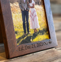 Custom engraved picture frame showcasing a couple, personalized with date.